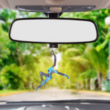 a car's rearview mirror with a picture of a person hanging from it