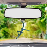 a picture of a person hanging from a car's rearview mirror