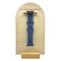 a wooden plaque with a blue watch on it