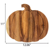 a wooden cutting board with a carving of a pumpkin