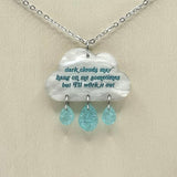 a necklace with a cloud and three tears hanging from it