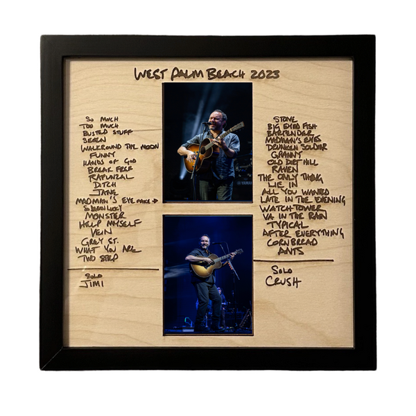 a wooden frame with a picture of a man playing a guitar