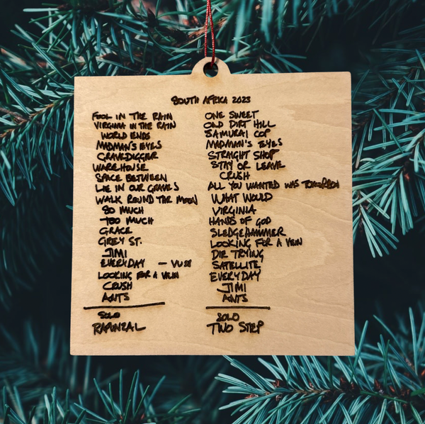 a wooden ornament hanging from a christmas tree