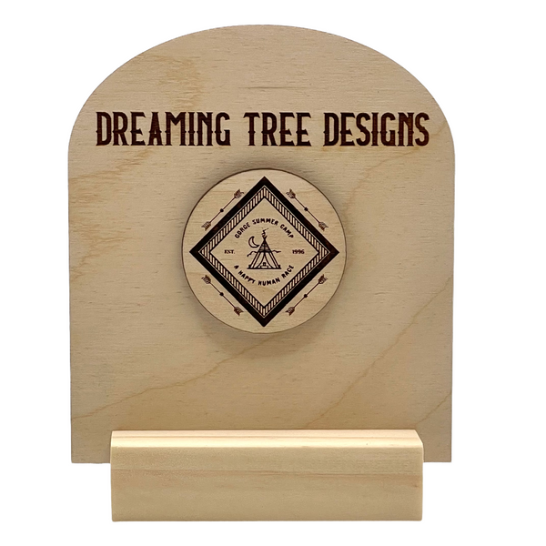 a wooden plaque with the words dreaming tree designs on it